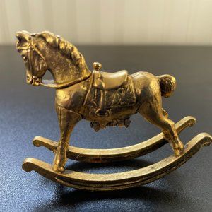 Vintage Max Factor golden rocking horse with hidden solid perfume unused